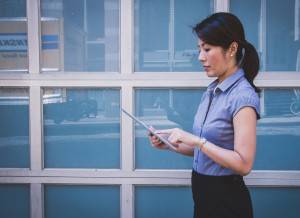 Woman works remotely with Cloud Services