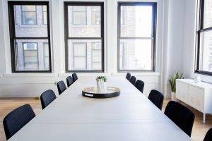 image of empty conference room to illustrate summer slowdown