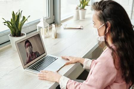 image of two people on a video meeting