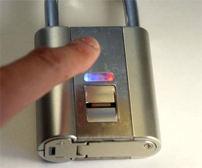 Image of finger about to activate an electronic padlock to illustrate NIST 800-171 security compliance requirements.