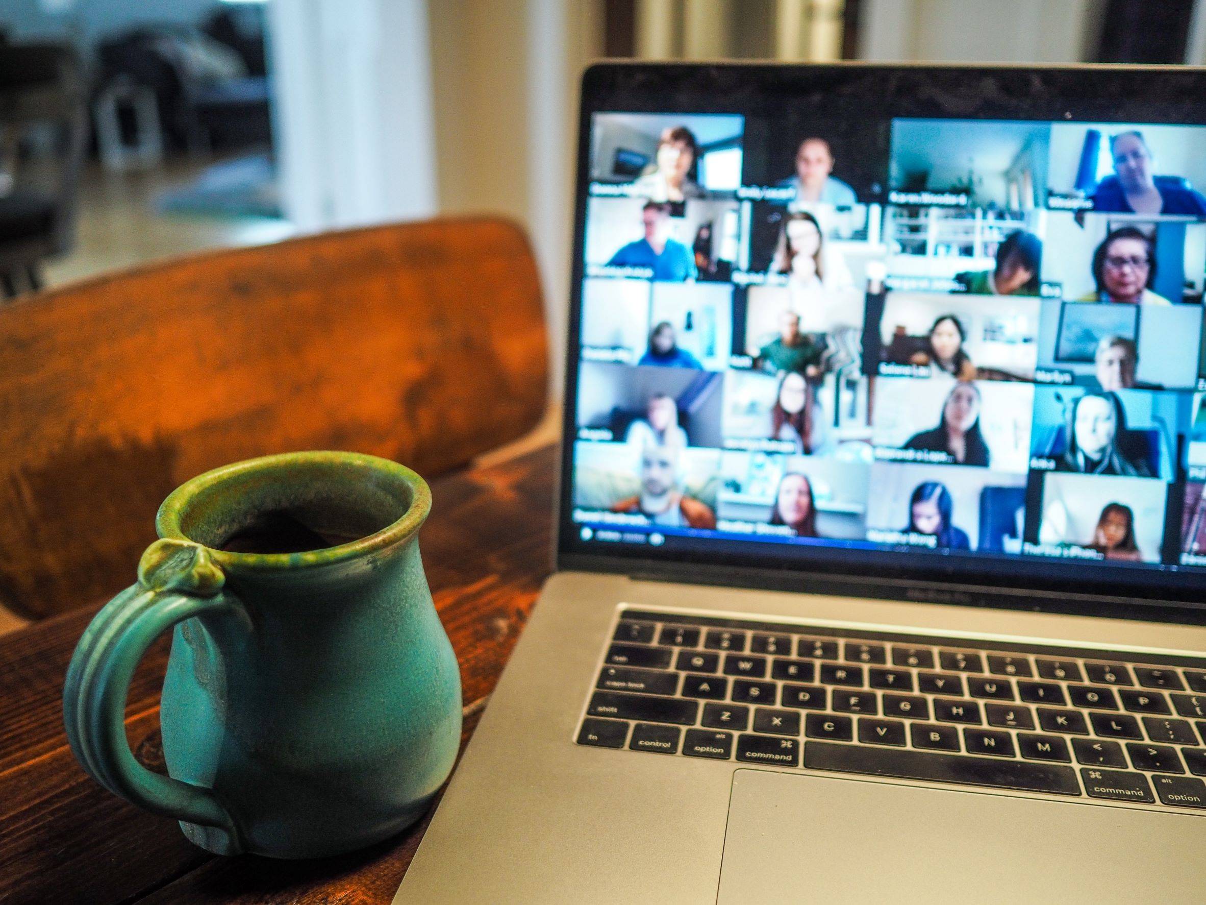 Coffee cup in front of Zoom meeting